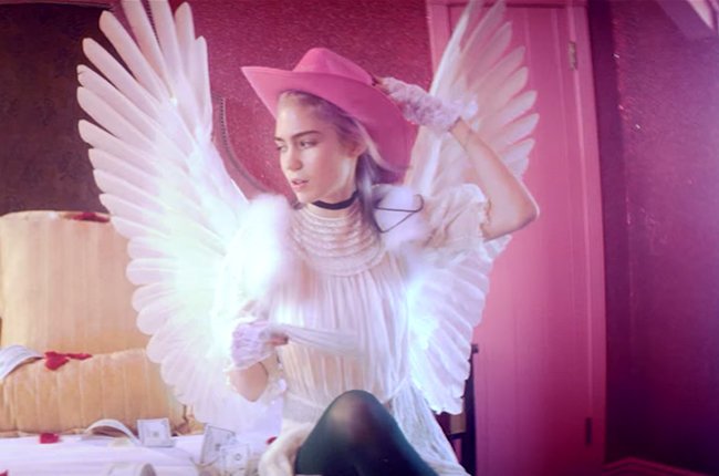 Grimes confirms Art Angels release dates, kills two birds with one new music video