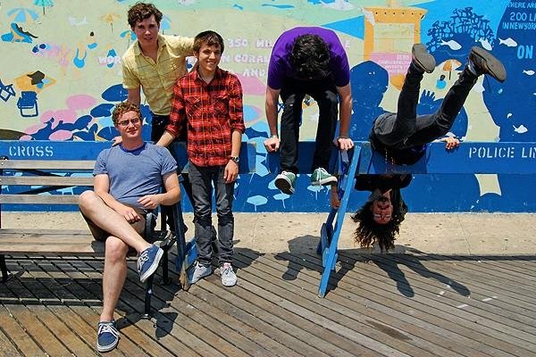 Surfer Blood sign to Warner Bros., stand in front of colored backdrops, officially morph into Weezer
