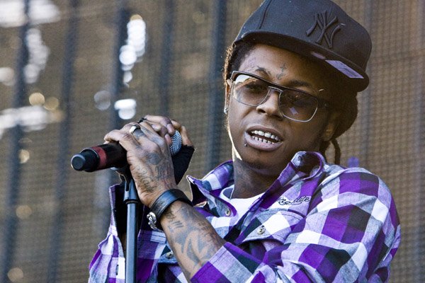 Lil Wayne's Tha Carter IV pushed back to June; Young Money promises free Lil Wayne pog with every copy