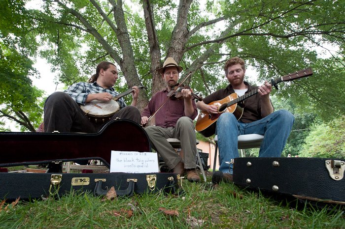 The Black Twig Pickers pack their bags and hit the road. Other band names they considered: The River Parade Gentlemen, The Lonely Gulch String Band, and The Cider Train Cats.
